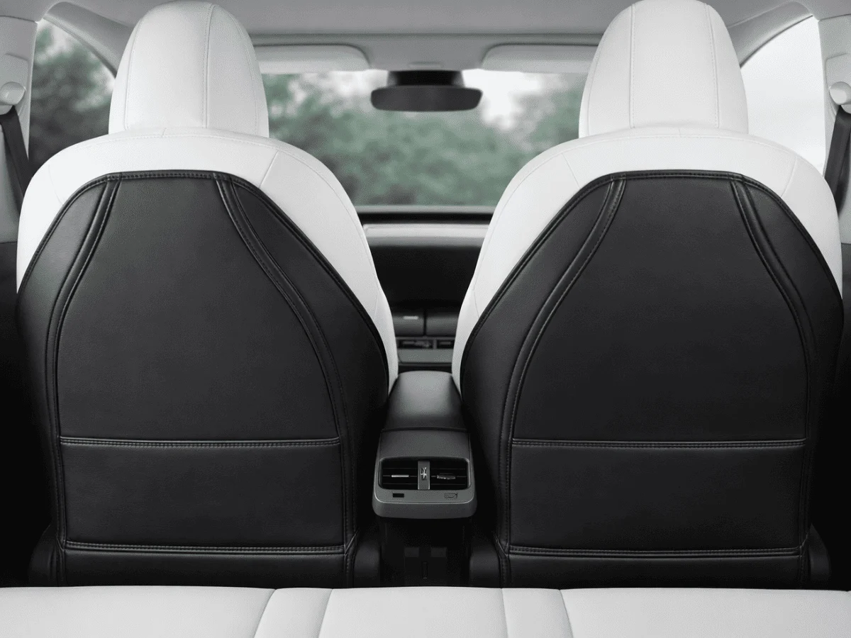 Tesla Model Y rear seat backs interior showing seat back protector area.